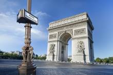 Enjoying panoramic views of the city from atop the Arc de Triomphe, a symbol of French triump