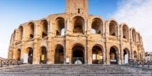 Immerse yourself in the rich history of Arles, where ancient Roman ruins coexist with vibrant Provençal culture