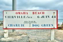 Standing on hallowed ground at Omaha Beach, where history echoes in the waves