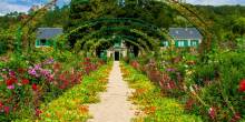 Strolling through the vibrant flower beds of Giverny Gardens, a paradise of colors
