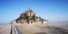 Gazing at the panoramic vista of the Normandy coastline from Mont Saint Michel